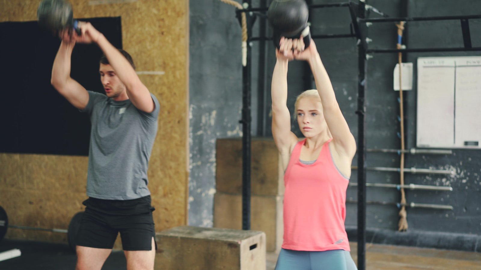 Kettlebell training in modern gym. Photo by Vitaly Gariev on Unsplash.